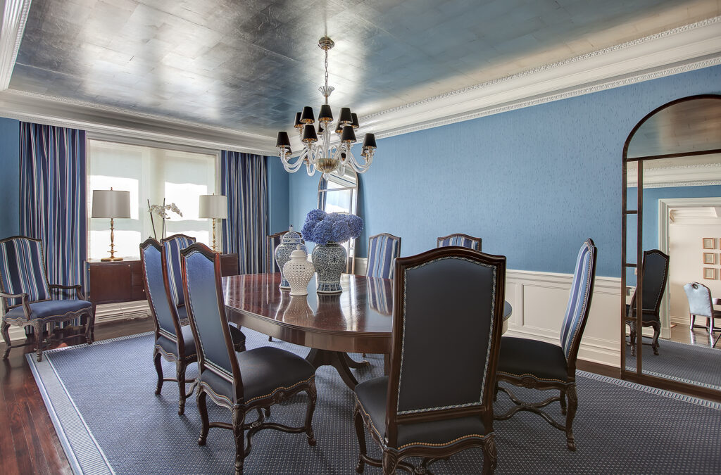 Blue dining room in Pound Ridge, NY with a metallic ceiling, crisp white trim, and a refined formal interior finish