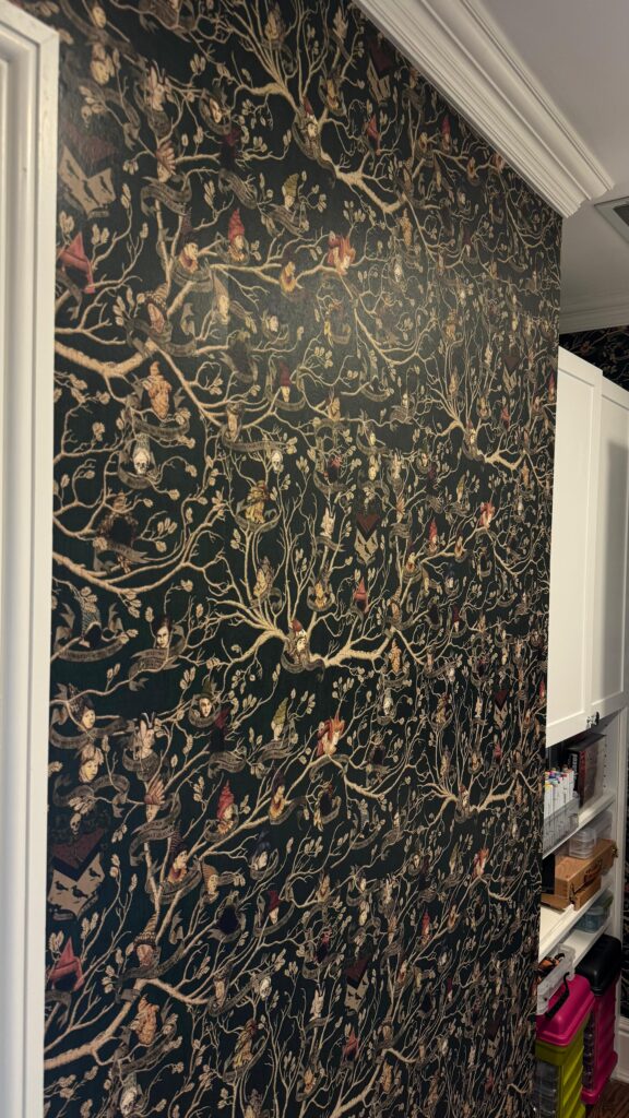 Textured stair hall wallpaper in New Canaan, CT with a dark botanical pattern, crisp trim edges, and a refined custom finish